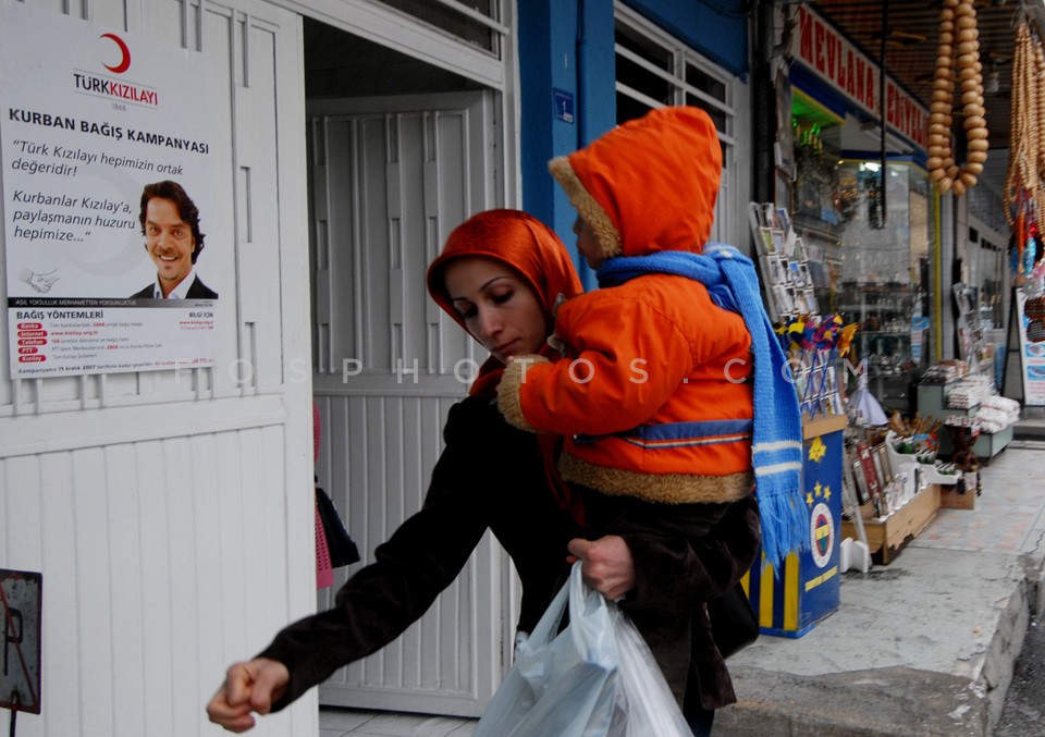 Mother waling holds a child