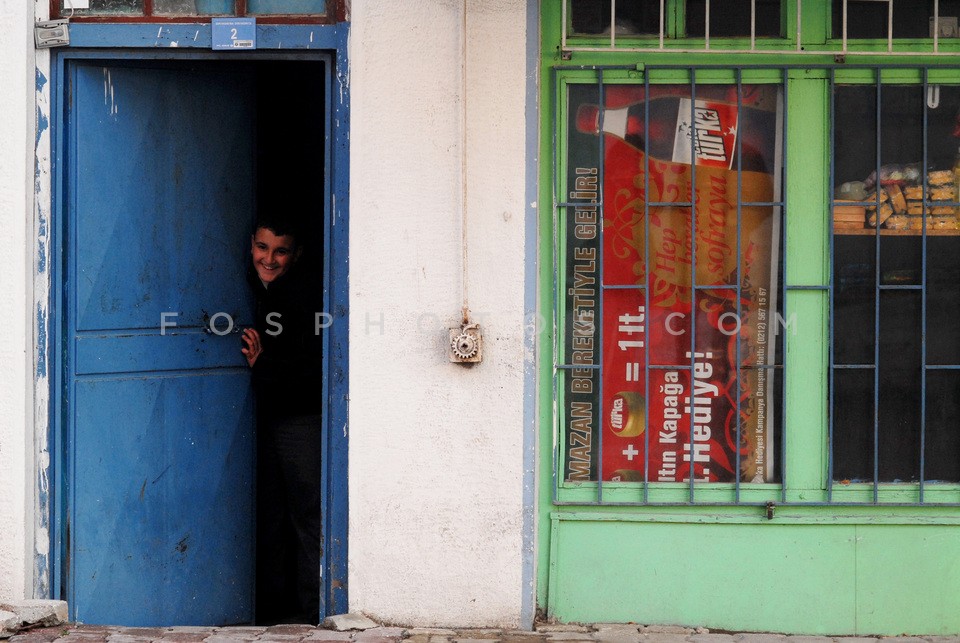 Boy hidden in a door